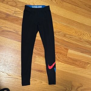 Nike woman’s Leggings in Black with Red and Blue Swoosh